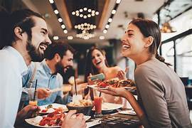 appy customers dining at Texas Roadhouse, enjoying VIP Club benefits on special occasions